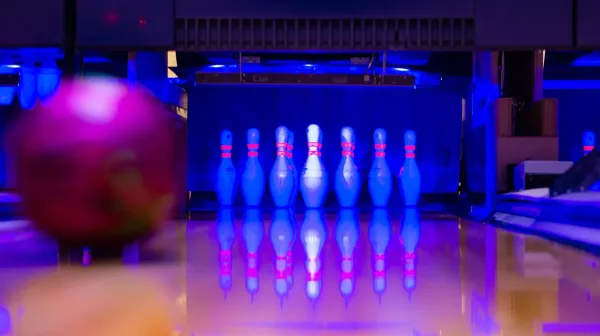 Bowling ball about to hit pins